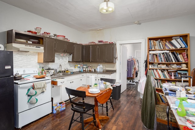  - kitchen with white electric range, freestanding refrigerator, dark wood-style flooring, and tasteful backsplash