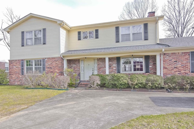 front facade with a front lawn