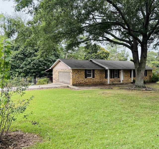 single story home with a front yard and a garage