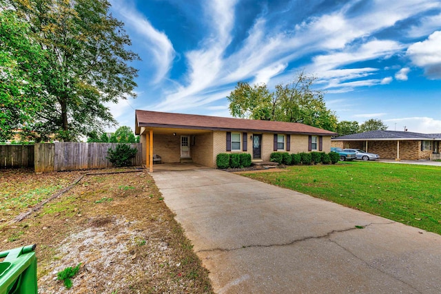 single story home featuring a carport and a front yard