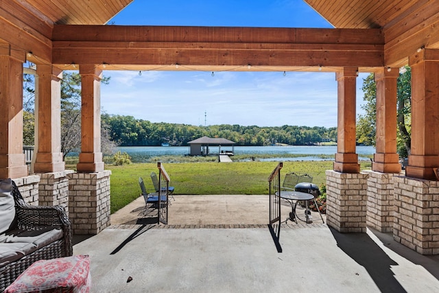 view of patio / terrace with a water view