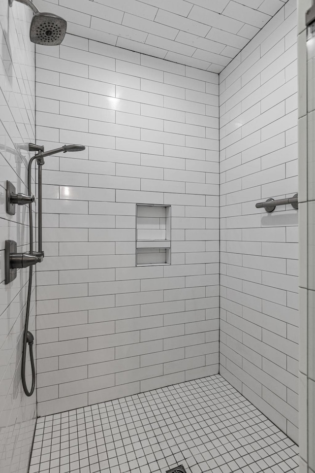 bathroom with a tile shower