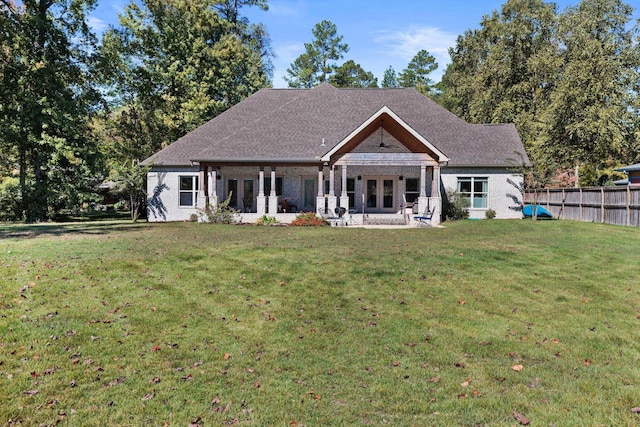 view of front of property with a patio area and a front yard