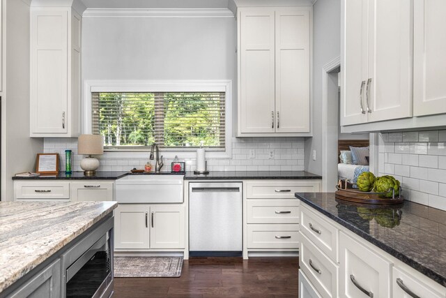 kitchen with sink, white cabinetry, and stainless steel appliances