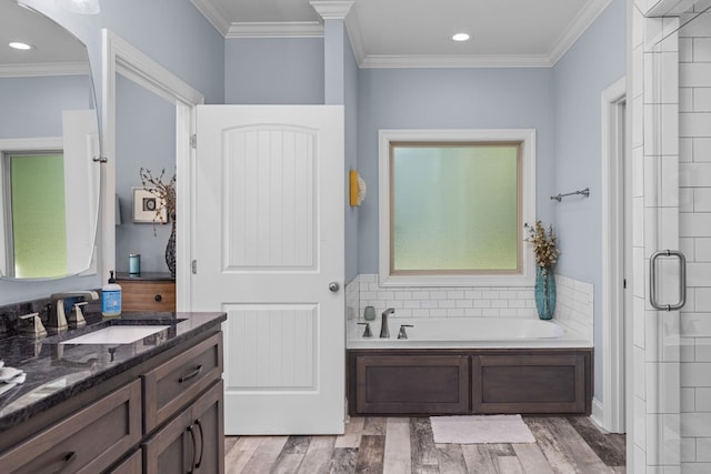 bathroom featuring hardwood / wood-style floors, vanity, crown molding, and independent shower and bath