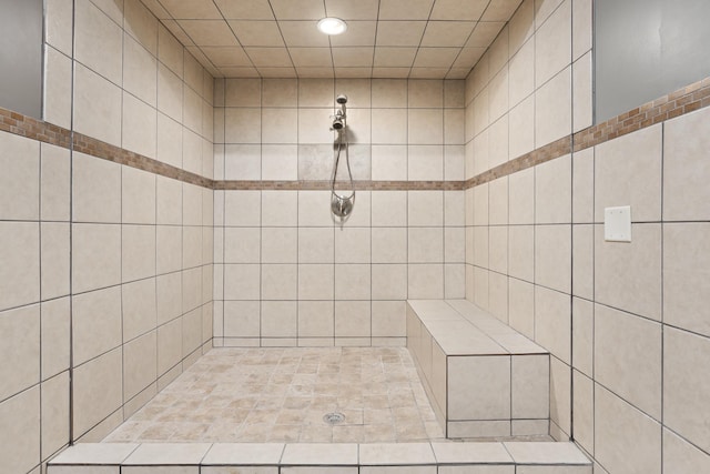 bathroom with a tile shower