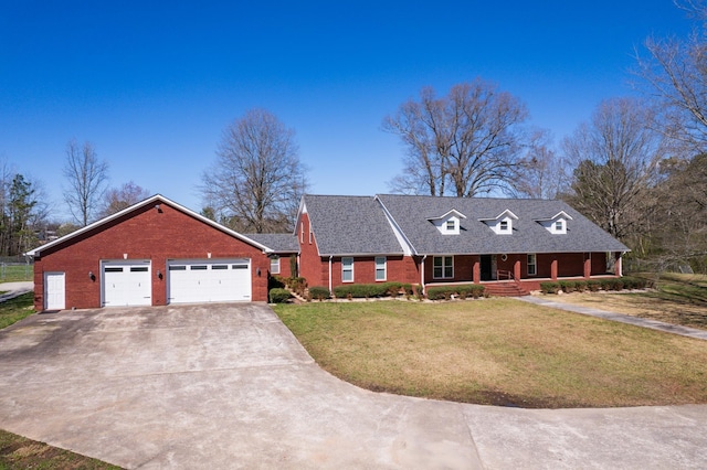 view of front facade with a garage and a front lawn