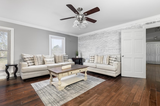 living room with plenty of natural light, crown molding, ceiling fan, and dark wood-type flooring