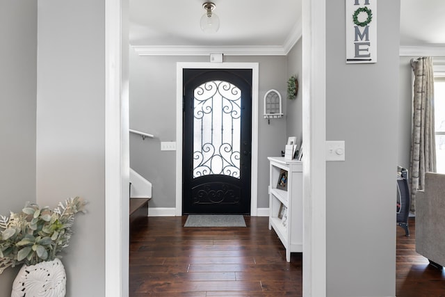 entrance foyer featuring dark hardwood / wood-style flooring, a wealth of natural light, and crown molding