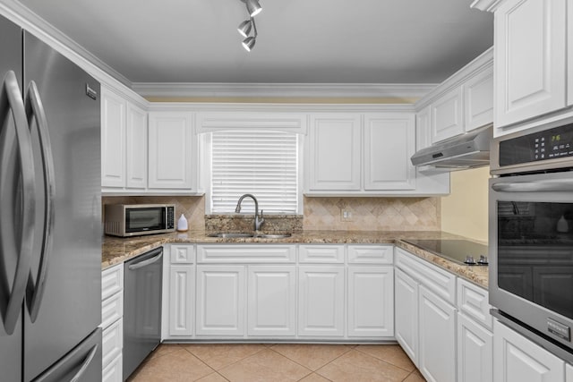 kitchen with white cabinetry, stainless steel appliances, sink, and light tile patterned floors