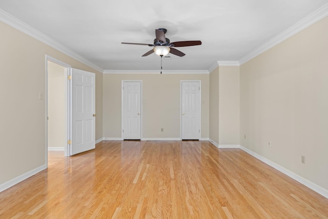 empty room with ornamental molding, ceiling fan, and light hardwood / wood-style floors