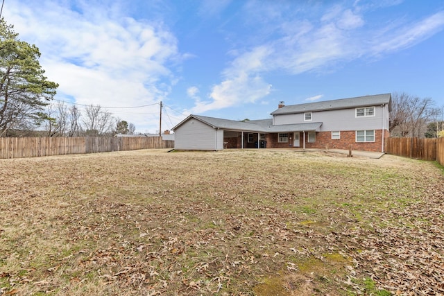 back of house with a yard