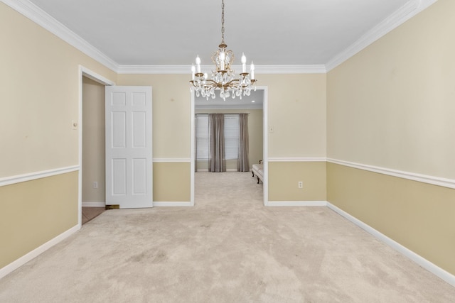 unfurnished room featuring crown molding, carpet floors, and a chandelier