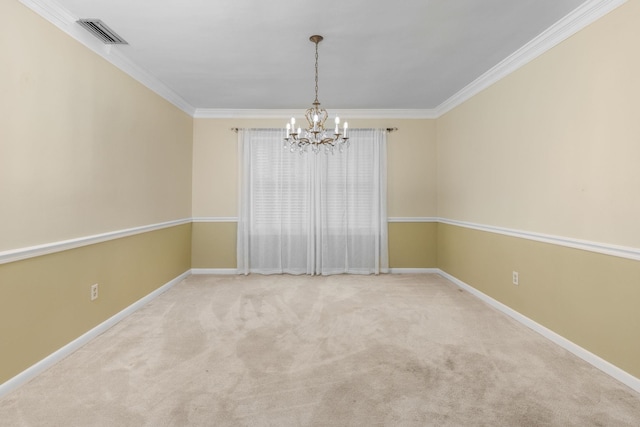 carpeted spare room with ornamental molding and an inviting chandelier