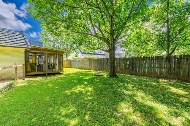  - fenced backyard featuring a sunroom