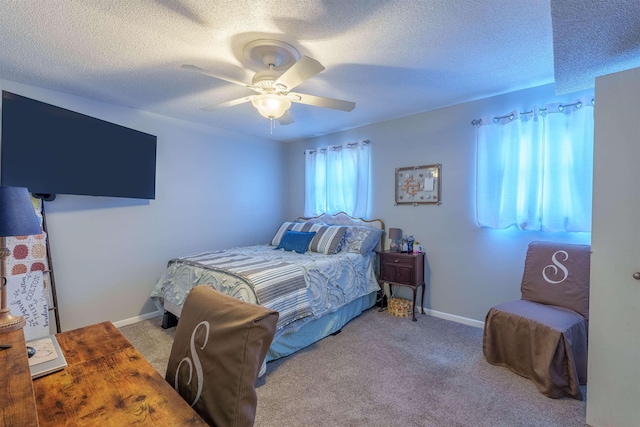  - bedroom featuring a textured ceiling, carpet floors, and ceiling fan