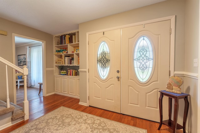  - entrance foyer with stairway and wood finished floors