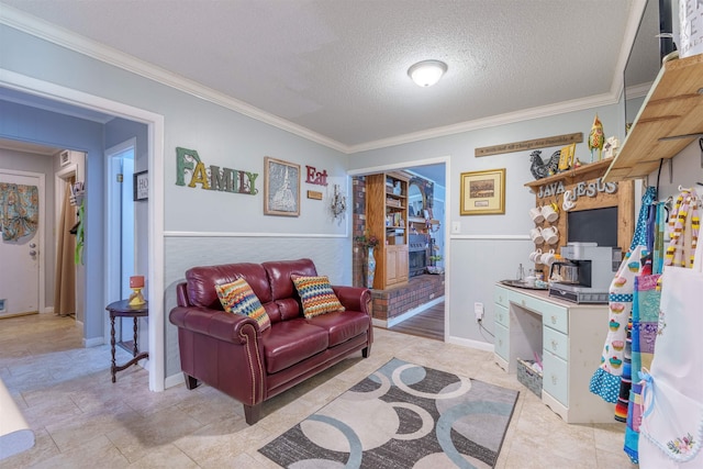  - living area featuring ornamental molding and a textured ceiling