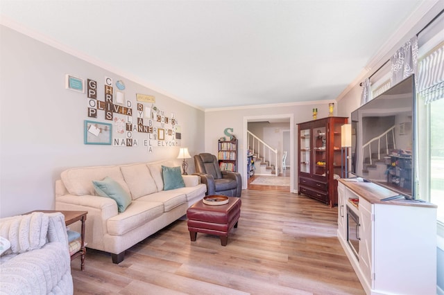  - living area with stairway, light wood-style flooring, and crown molding