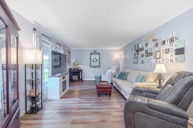  - living area featuring ornamental molding and light wood-type flooring