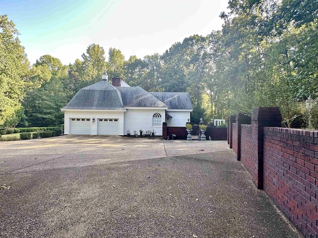 view of home's exterior with a garage