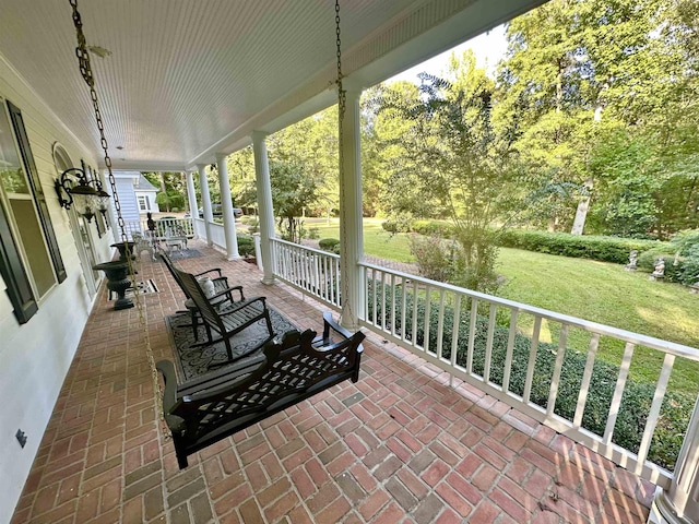 view of patio featuring a porch