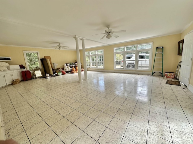 tiled living room featuring ceiling fan, ornamental molding, and decorative columns