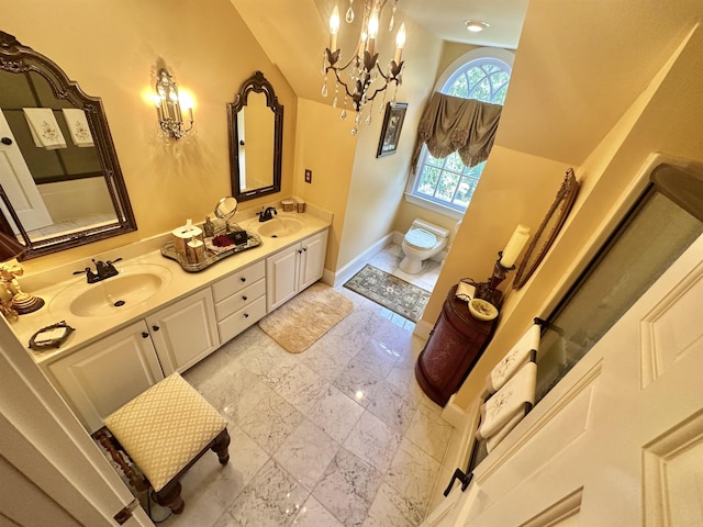 bathroom featuring vanity and a notable chandelier