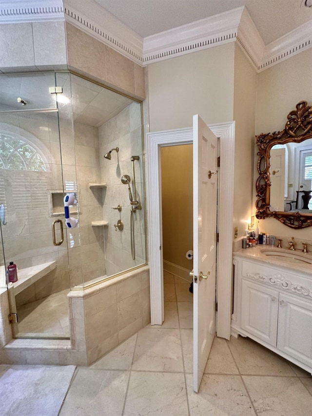 bathroom with vanity, crown molding, and walk in shower