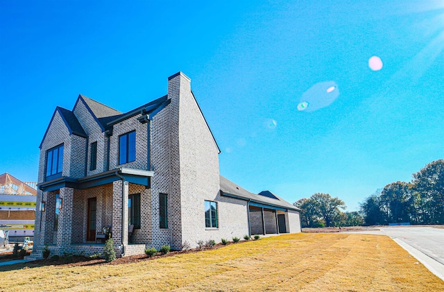 view of property exterior featuring a lawn