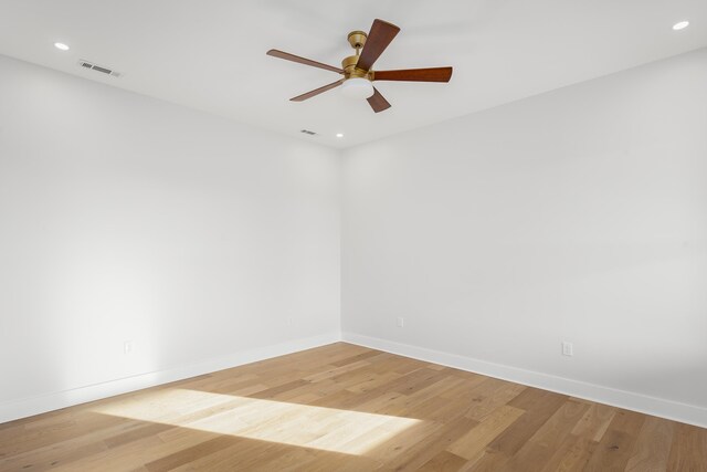 living room featuring ceiling fan and wood-type flooring