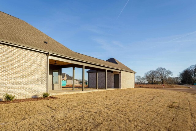 exterior space featuring ceiling fan