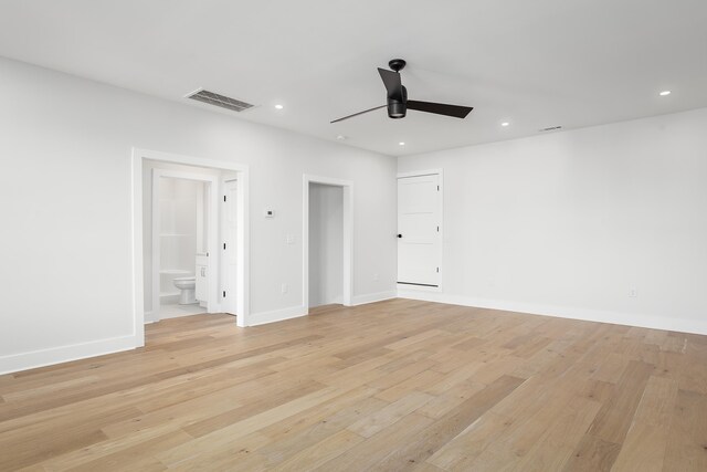 spare room featuring light hardwood / wood-style floors and ceiling fan