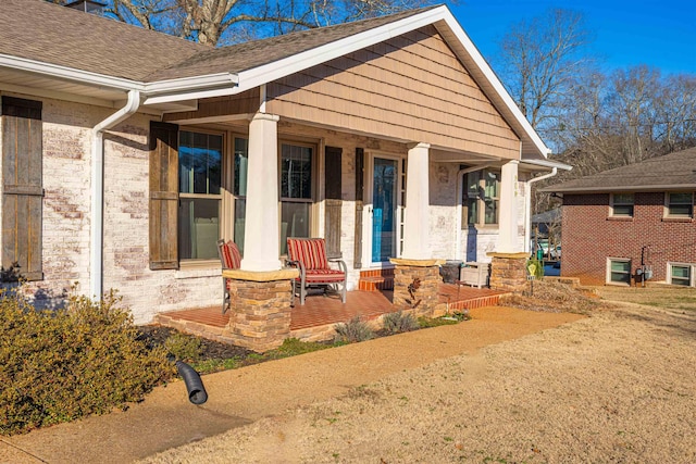 property entrance featuring a porch