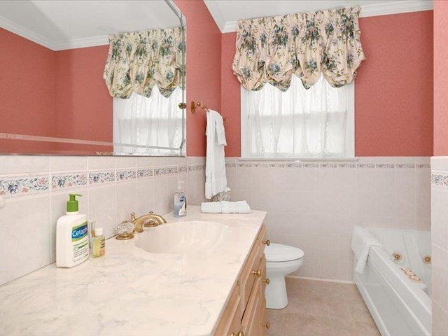 bathroom featuring vanity, a wealth of natural light, a whirlpool tub, and ornamental molding