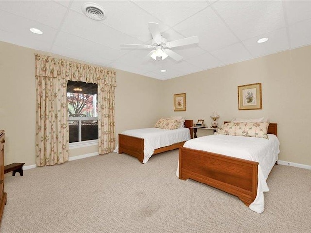 bedroom featuring baseboards, visible vents, ceiling fan, and carpet