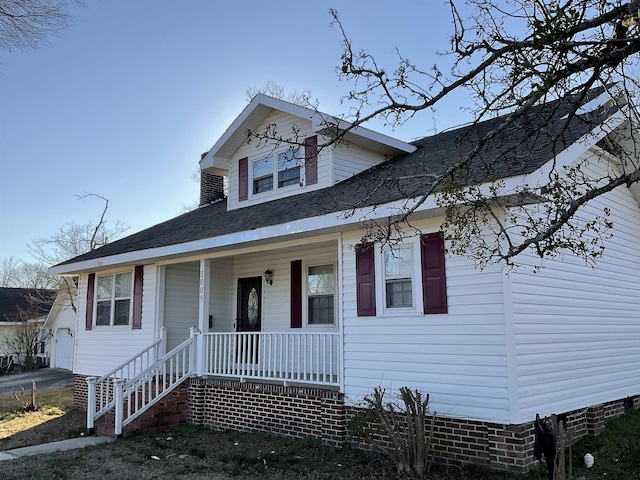 view of front of house with a garage and covered porch