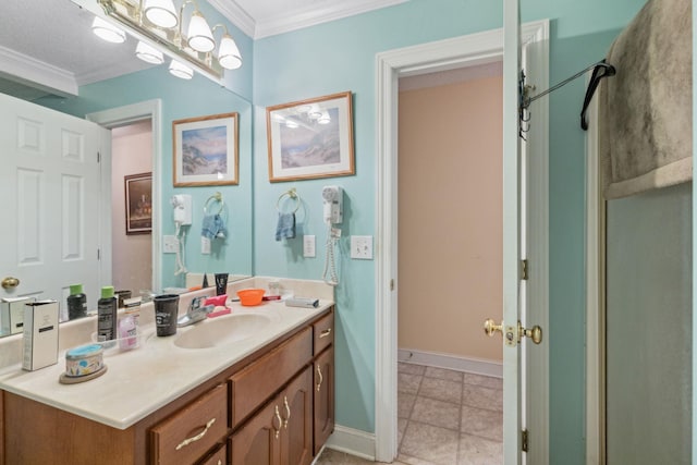 bathroom featuring crown molding, vanity, and tile patterned floors