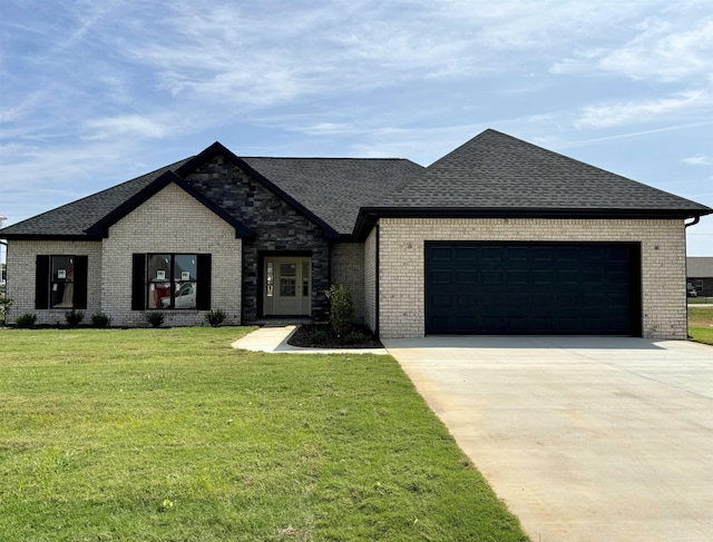 view of front facade featuring a garage and a front lawn