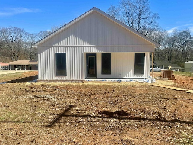 back of property with a porch