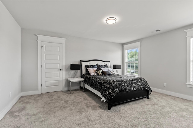  - carpeted bedroom with visible vents and baseboards