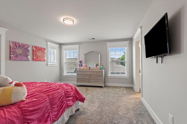  - bedroom with carpet flooring, baseboards, and visible vents