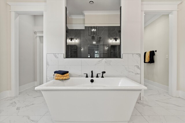  - full bath with crown molding, a freestanding tub, baseboards, and marble finish floor