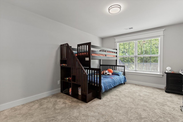  - bedroom featuring baseboards, visible vents, and carpet