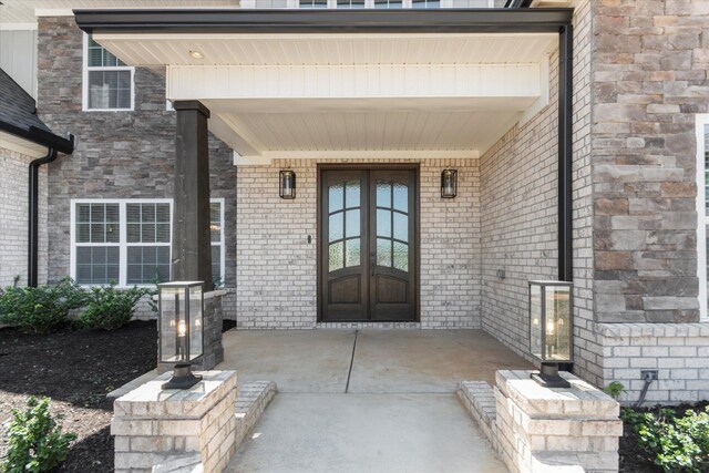  - entrance to property with covered porch and brick siding