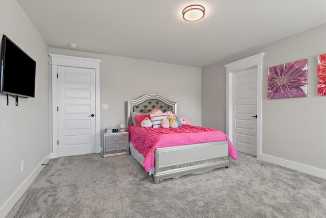  - bedroom featuring carpet floors and baseboards