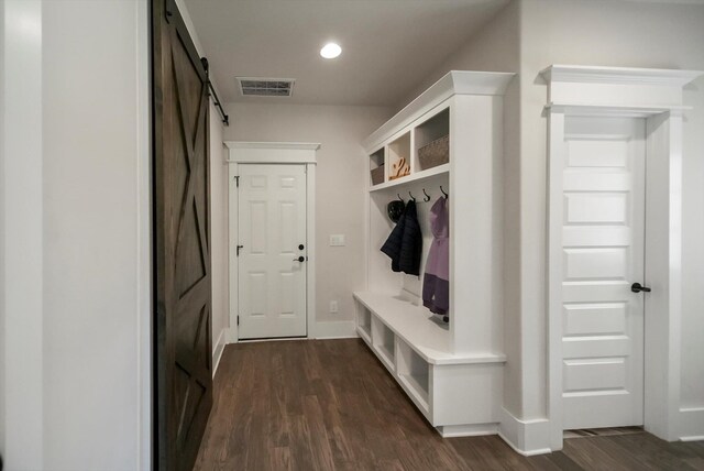  - mudroom featuring dark wood-style flooring, a barn door, recessed lighting, baseboards, and visible vents