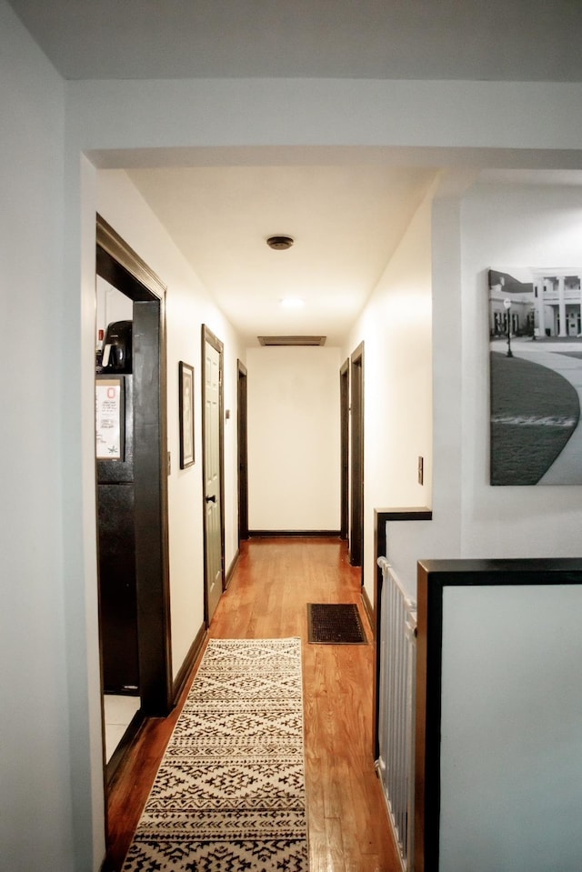 hallway featuring light hardwood / wood-style floors