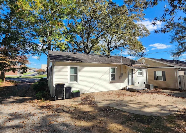 back of property featuring cooling unit