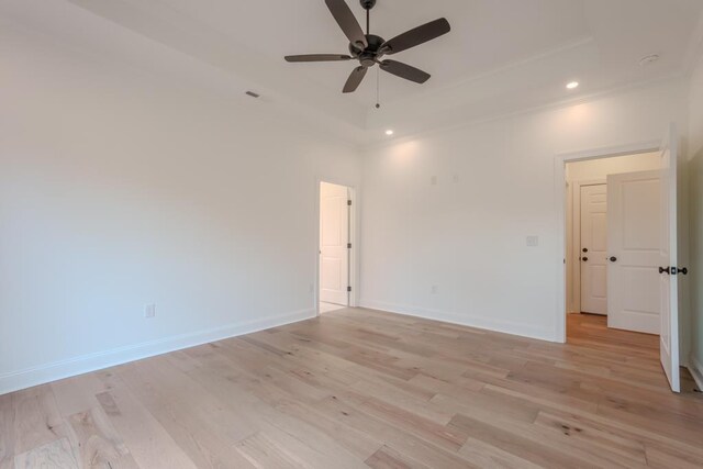 unfurnished room featuring ceiling fan, crown molding, and light hardwood / wood-style flooring